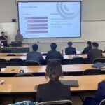 Photo of industry reps from Millennium giving a presentation to FM students.