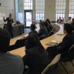 Photo of industry rep from TOBAM giving a presentation to FM students.