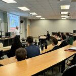 Photo of First Citizens Wealth representative giving a presentation to FM students.